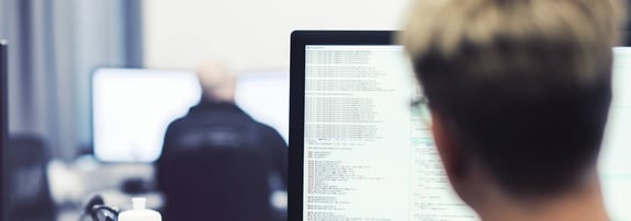 person at a computer coding